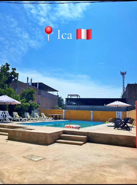 a swimming pool with a red ball in the sky at Casa Montemira in Ica
