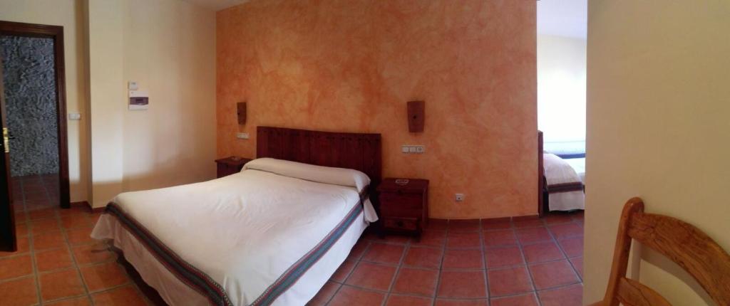Cama o camas de una habitación en Hostal Mulhacen