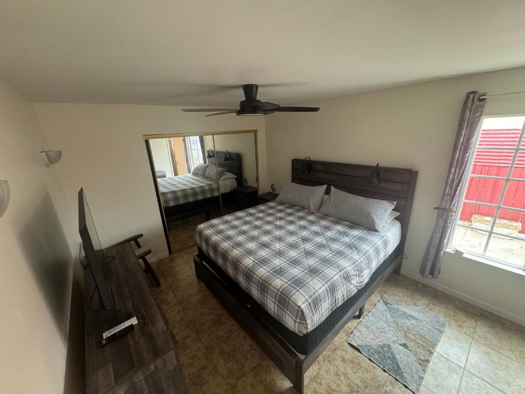 a bedroom with a bed and a mirror at King's Suite Escape in Ontario
