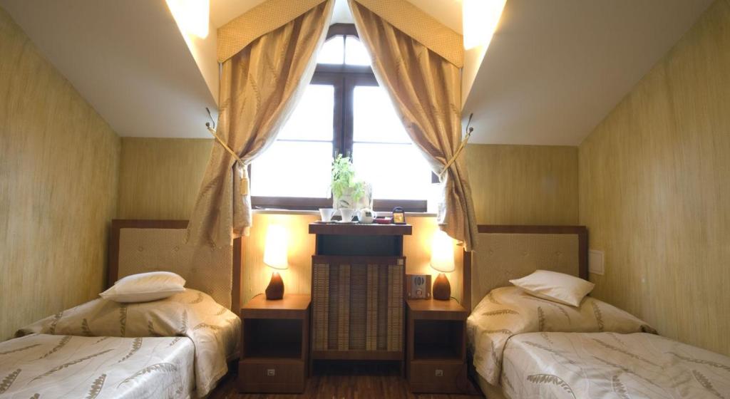 Posteľ alebo postele v izbe v ubytovaní Manor House SPA Luxury of Silence
