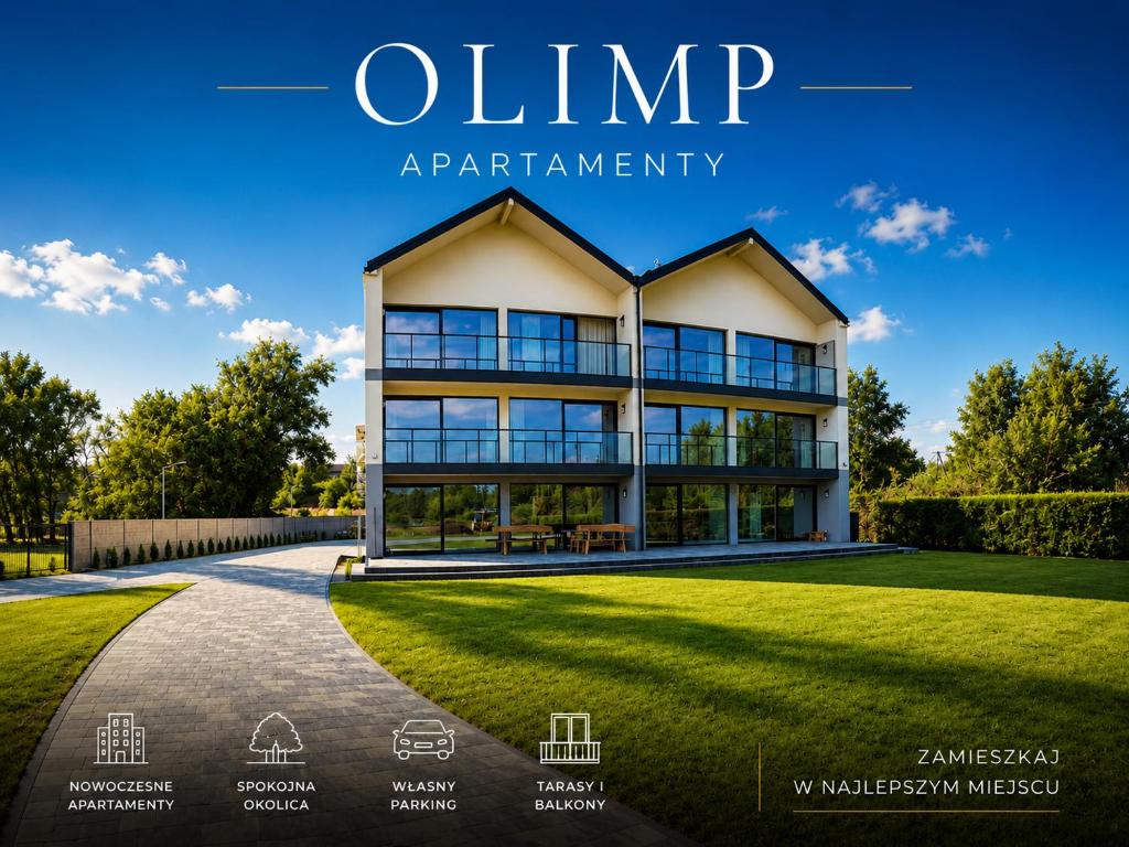 a view of a house with a lawn at Olimp Apartamenty in Konin