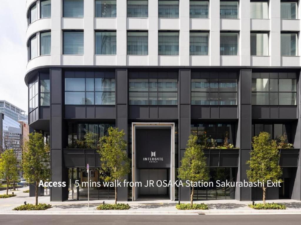 an office building with a sign in front of it at Hotel Intergate Osaka Umeda in Osaka