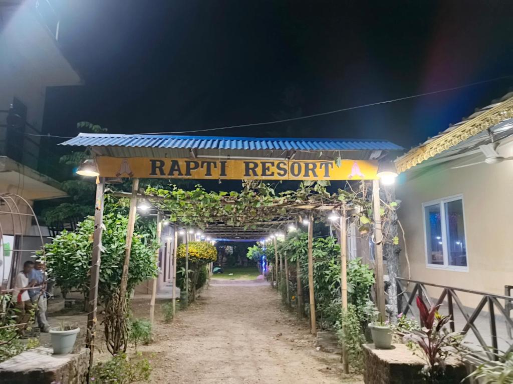 a path leading to a resort at night at Rapti Resort in Jhawāni