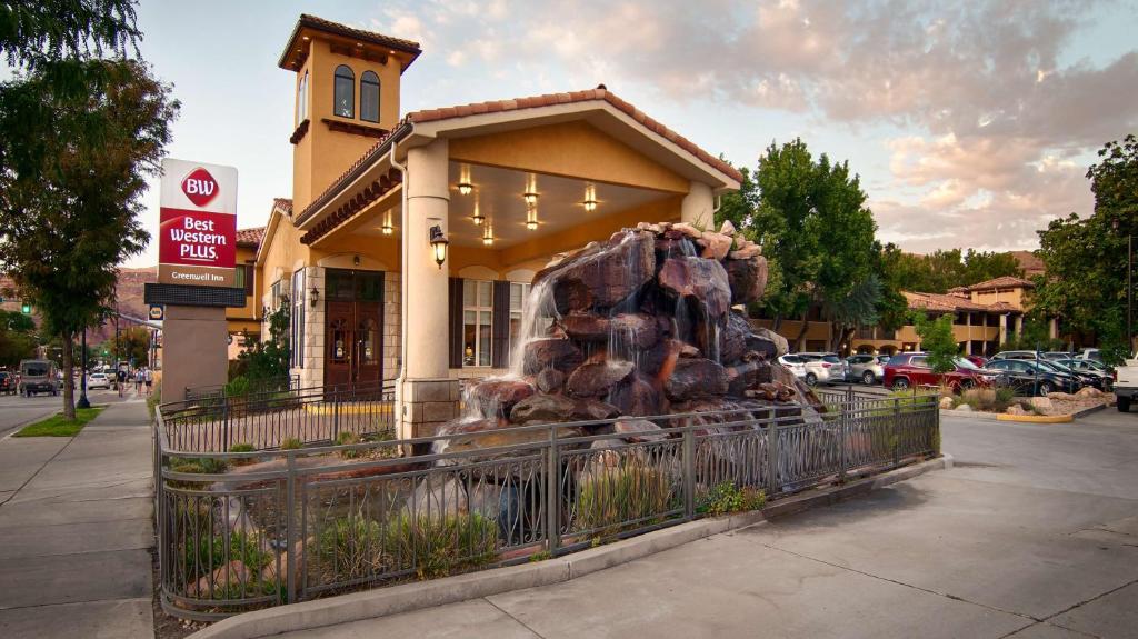 a building with a statue in front of it at Best Western Plus Greenwell Inn in Moab
