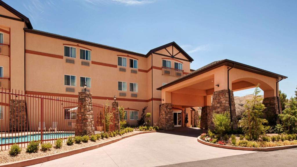 a large building with a driveway in front of it at Best Western Plus Zion West in La Verkin