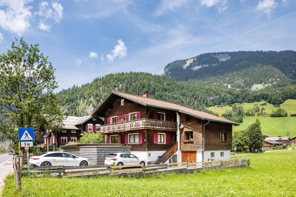 a house with two cars parked in front of it at Haus Helena Sophia in Au