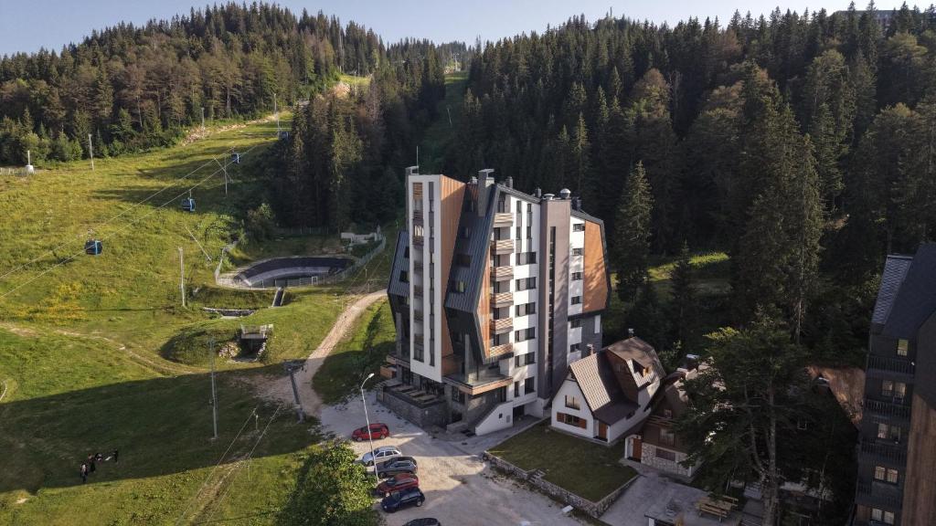 an aerial view of a building on a hill at Aparthotel Poljice in Jahorina
