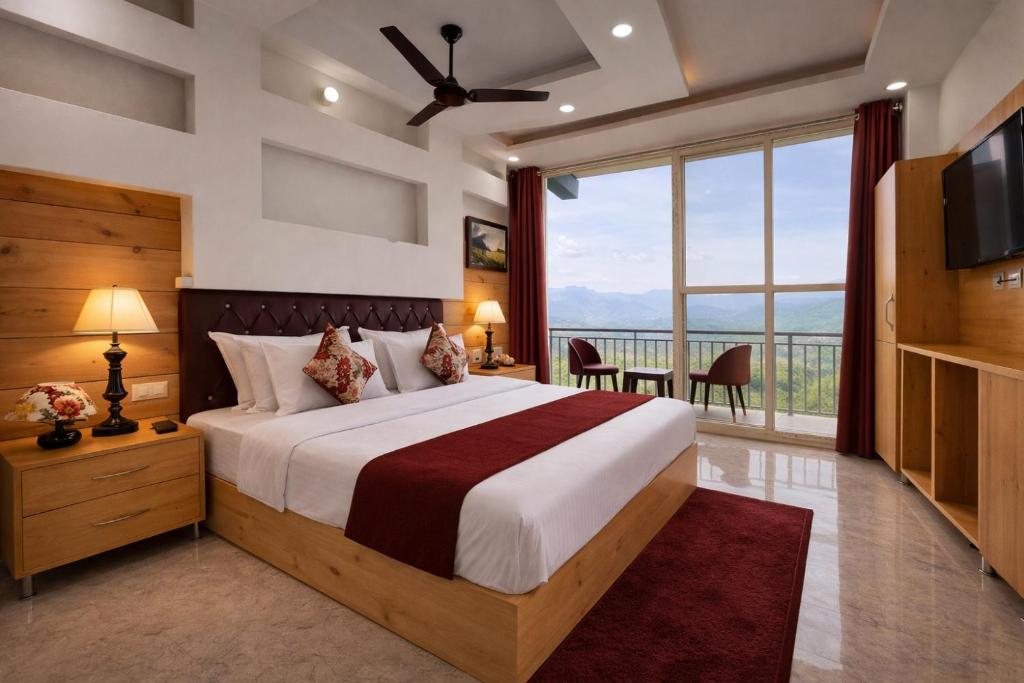 a bedroom with a large bed and a large window at Woods Villa Cottages Manali - 1,2,3,4 Bedrooms Luxury Cottages & Villa Available in Manali with Scenic Mountain View, Manali in Manāli
