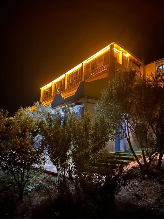 a building with lights on top of it at night at Olea Azul in Chefchaouen