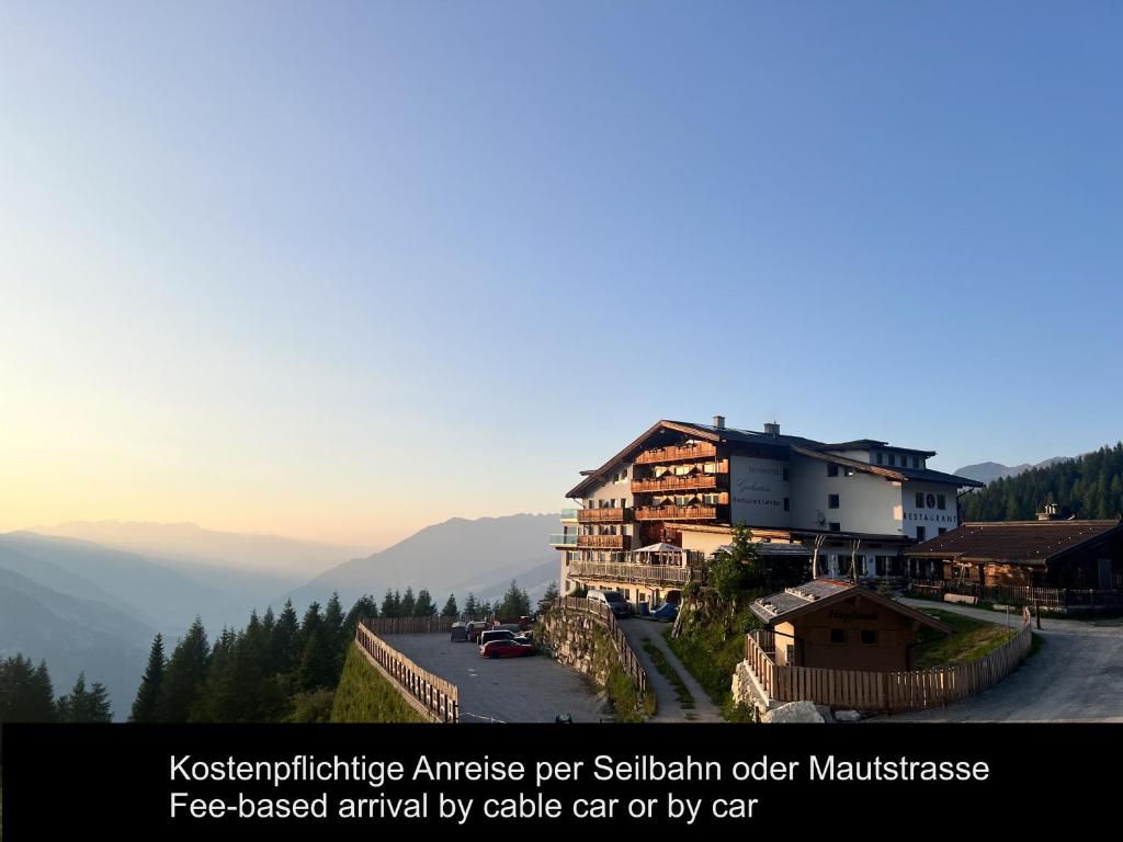 a building on the side of a mountain at Berghotel Gerlosstein in Hainzenberg