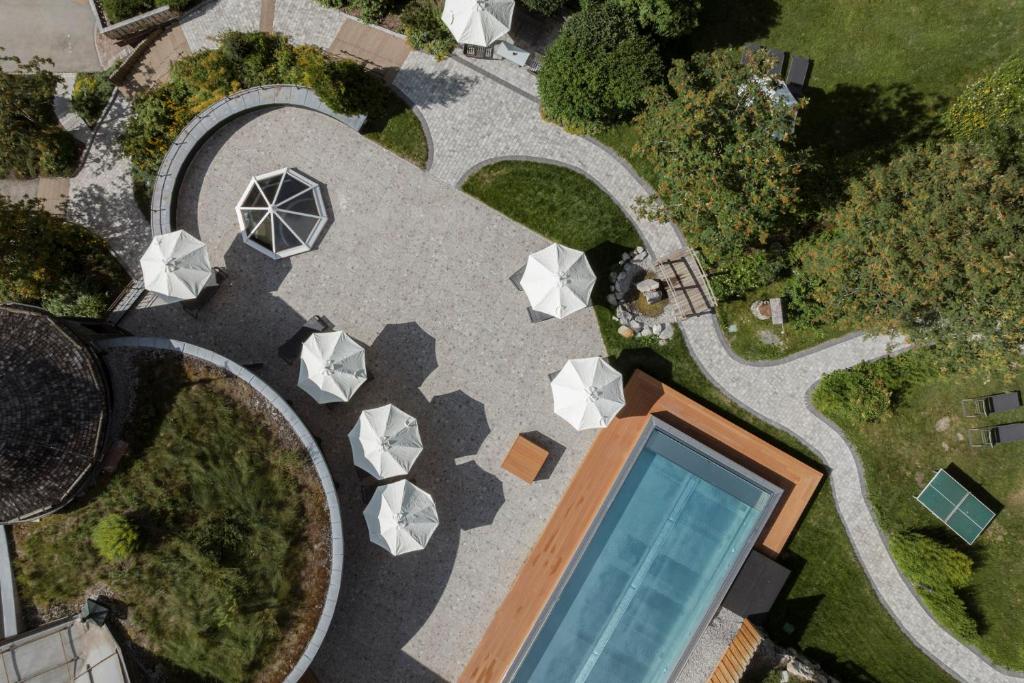 an overhead view of a house with a swimming pool at VAYA Lechtal in Elbigenalp