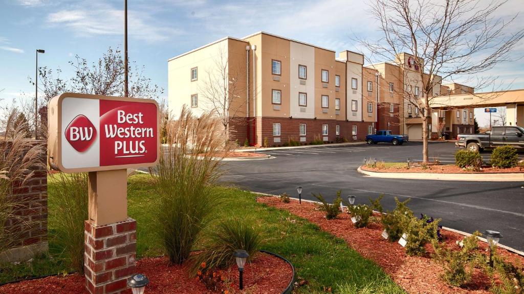 a best western plus sign in front of a building at Best Western Plus Crawfordsville Hotel in Crawfordsville