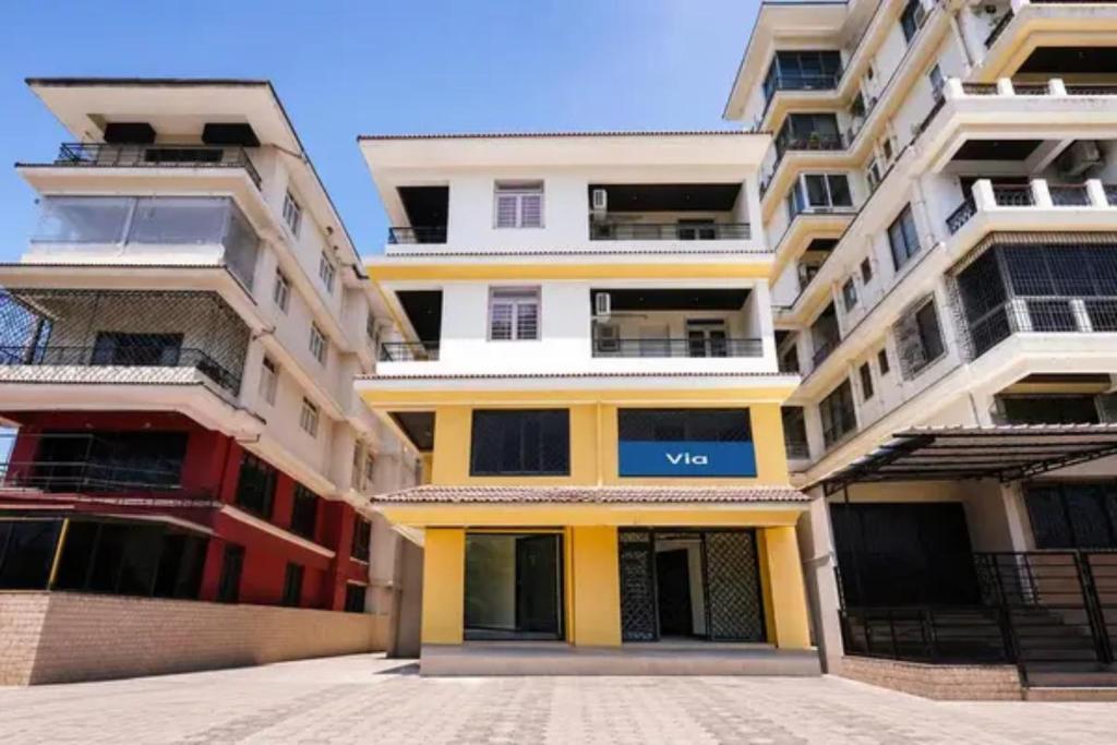 a row of tall apartment buildings in a city at Via Sagar Darshan in Panaji
