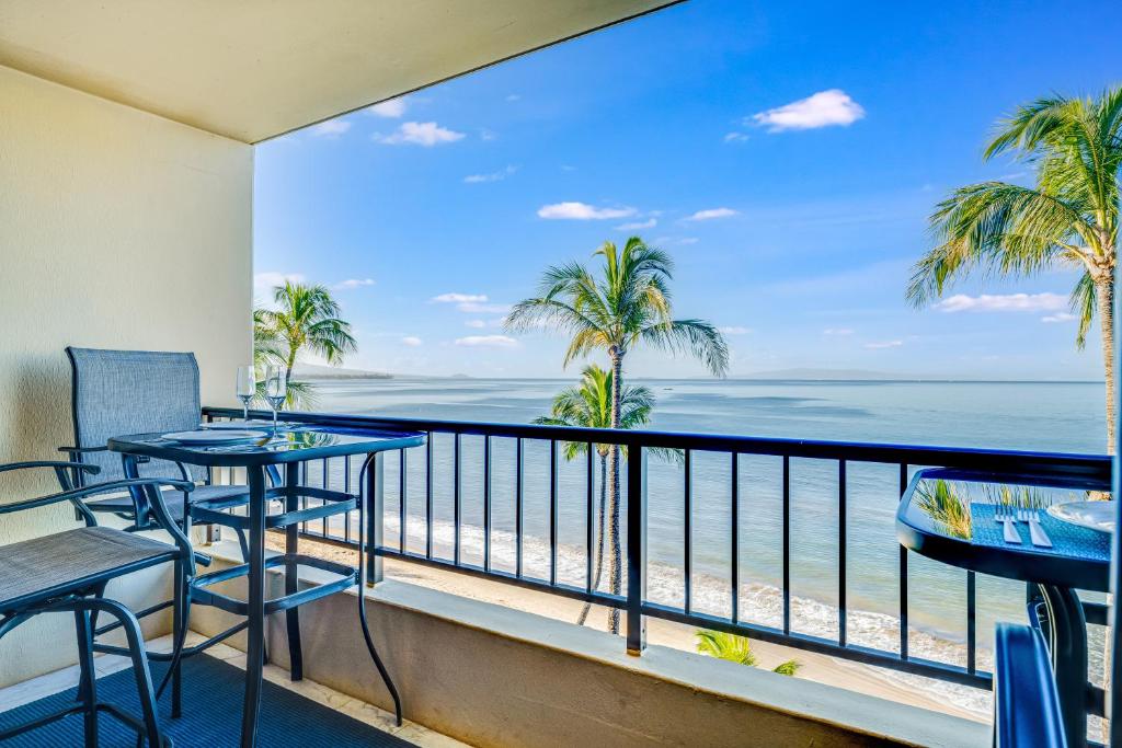 a balcony with a view of the ocean at SUGAR BEACH RESORT, #PH27 in Kihei