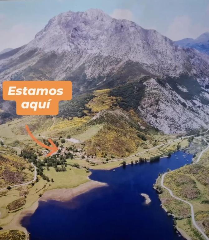 an aerial view of a lake and a mountain at Albergue el Caseron de Fuentes Carrionas in Cardaño de Abajo