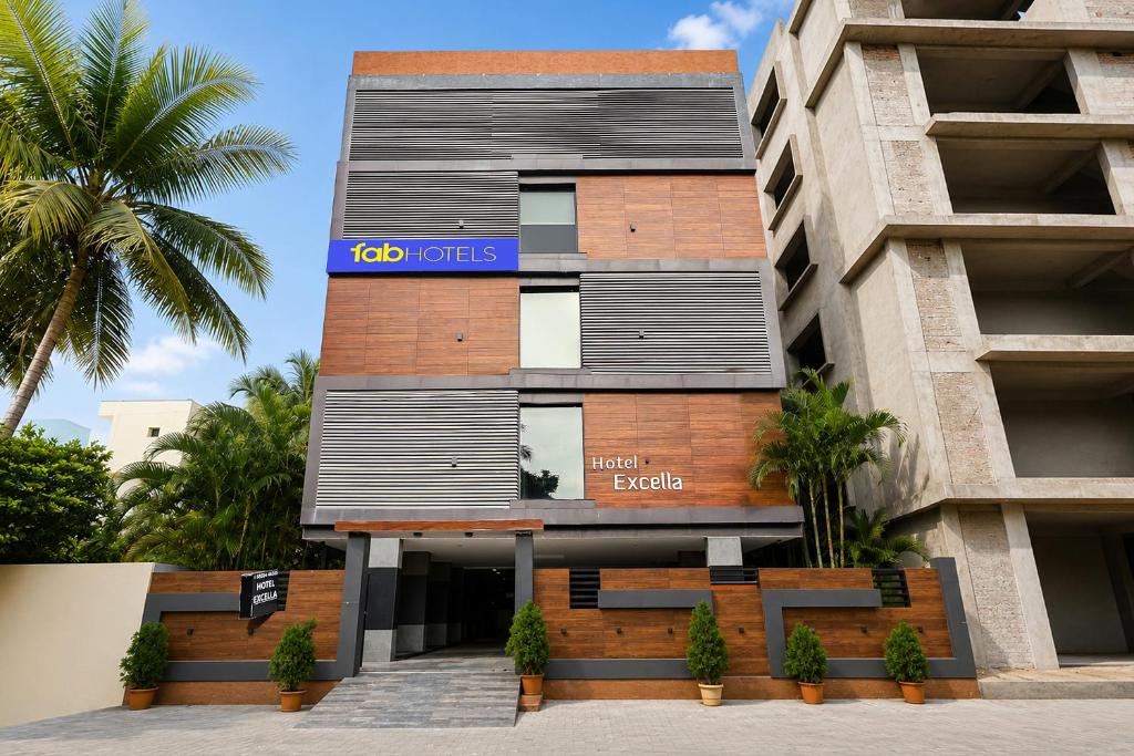a building with a sign on the side of it at FabHotel Excella Vizag in Visakhapatnam