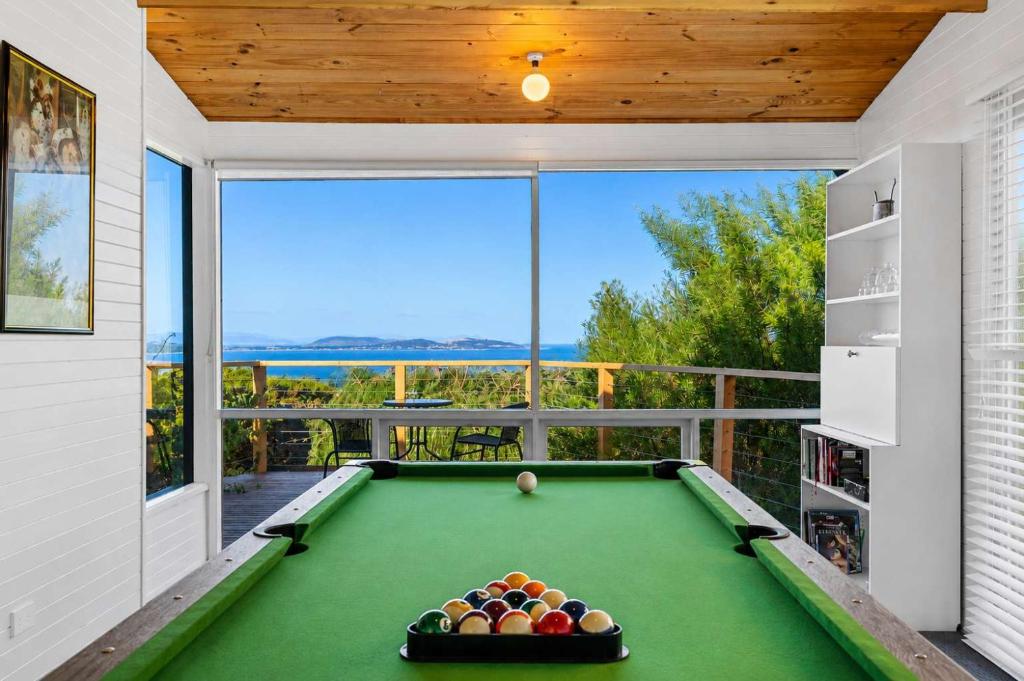 a pool table in a room with a view at Ocean Views 20kms from CBD Sleeps 10 in Kingston Beach