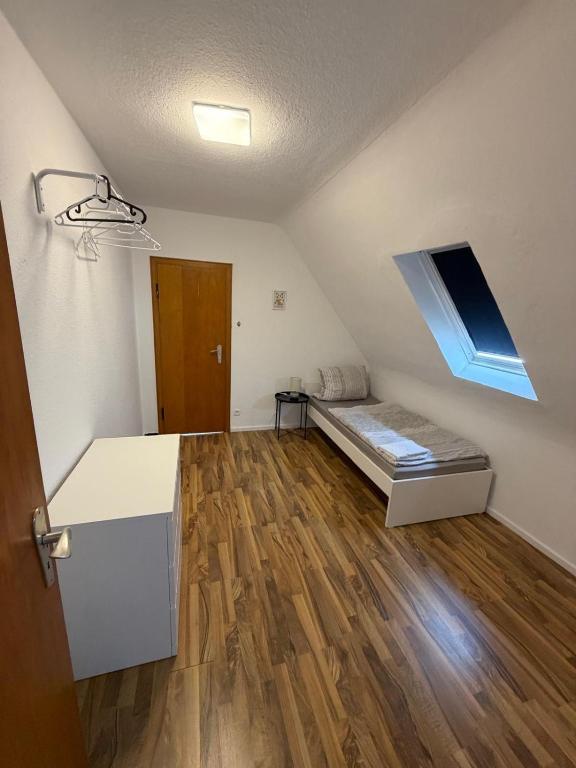a small room with a bed and a window at Monterus Fürst in Fürstenau