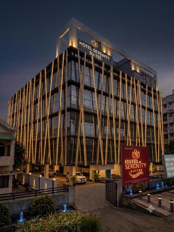 a building with a sign in front of it at Hotel Serenity Suites in Nagpur