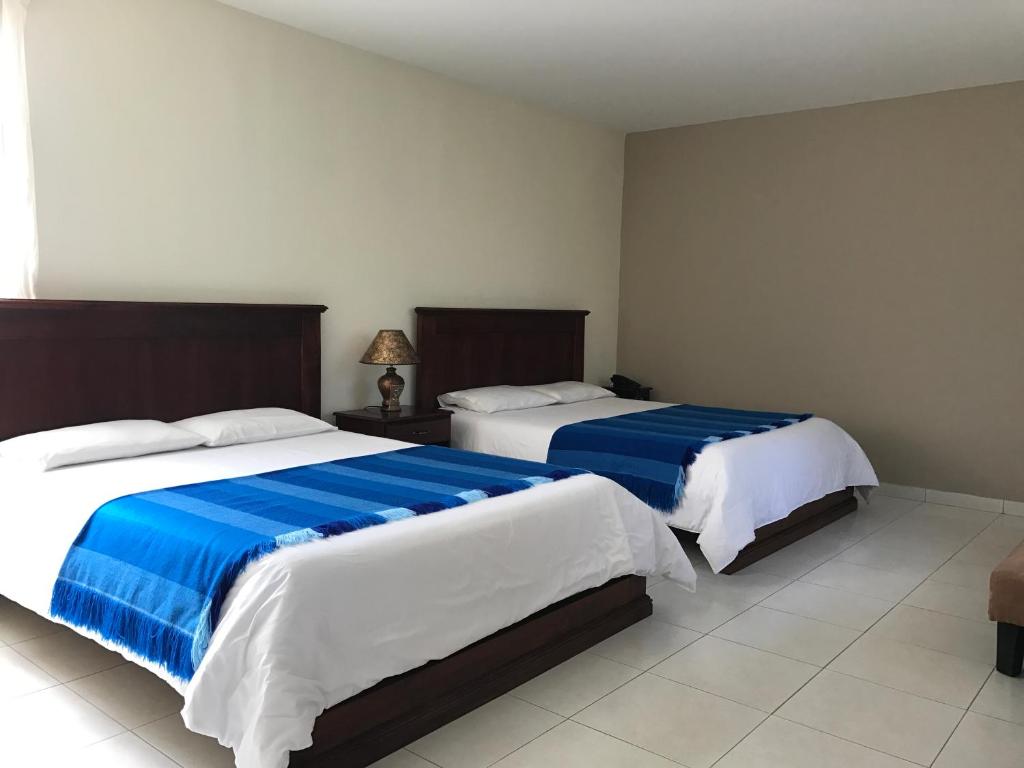 Postel nebo postele na pokoji v ubytování La Quinta San Andrés