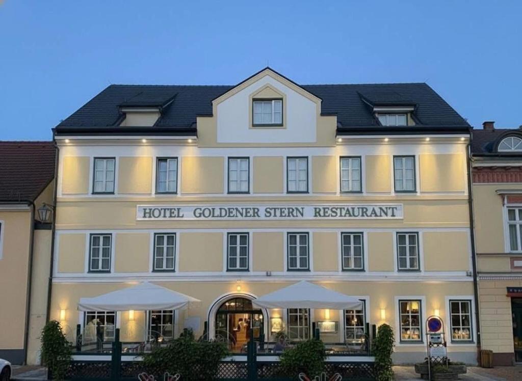 a hotel with a sign on the front of it at Hotel & Restaurant Stern in Gmünd
