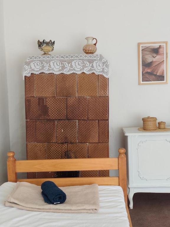 a bedroom with a brick wall and a bed at Natasa in Bačka Palanka