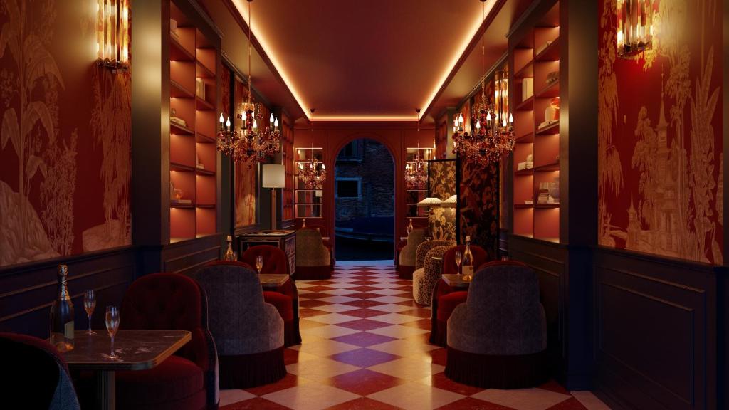 a bar with chairs and tables in a room at Eight Venezia in Venice