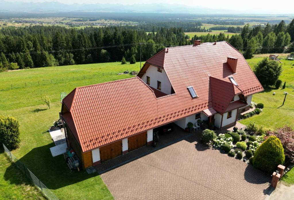 an overhead view of a house with a red roof at Wypoczynek nad Doliną in Orawka