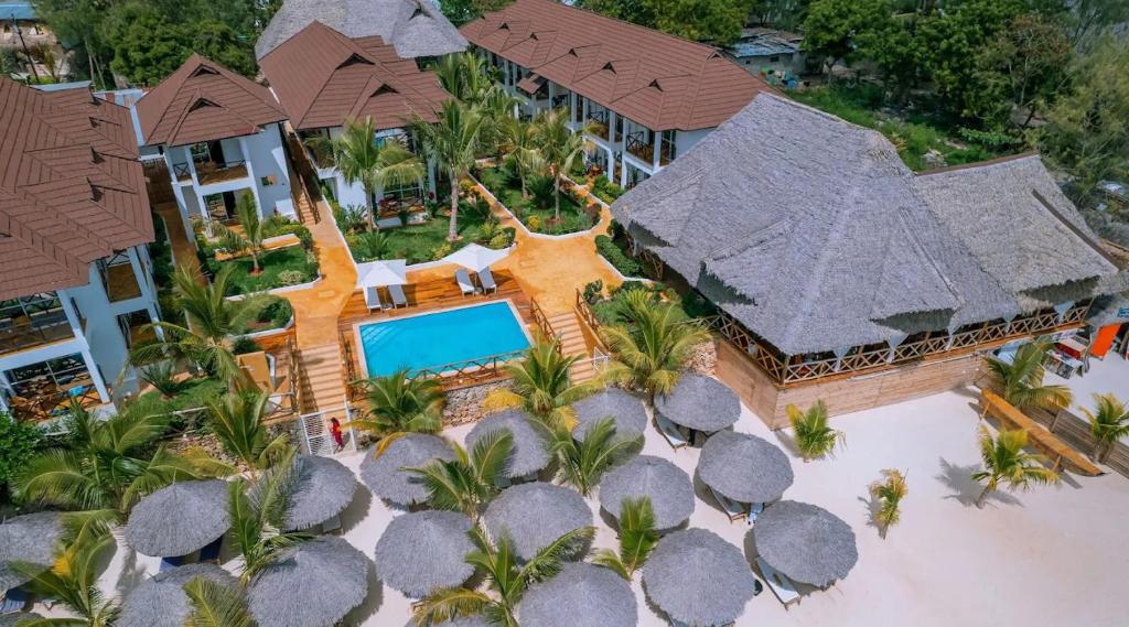 an aerial view of a villa with a swimming pool at Sansi Kendwa Beach Resort in Kendwa