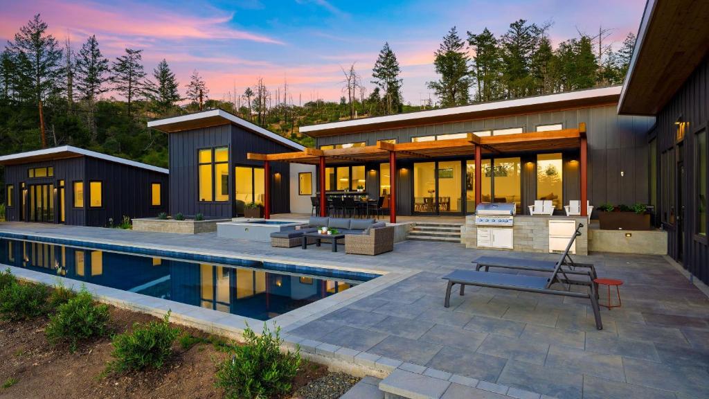 a house with a swimming pool in front of it at Olive Oak by AvantStay in Glen Ellen