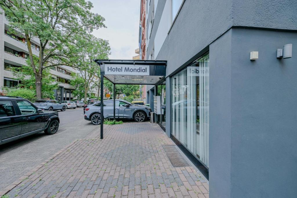 a sign for a hotel market on the side of a building at Hotel Mondial Comfort - Frankfurt City Centre in Frankfurt