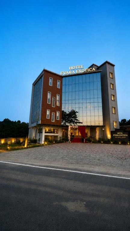 a large building with a sign on top of it at Evara Exotica in Darbhanga
