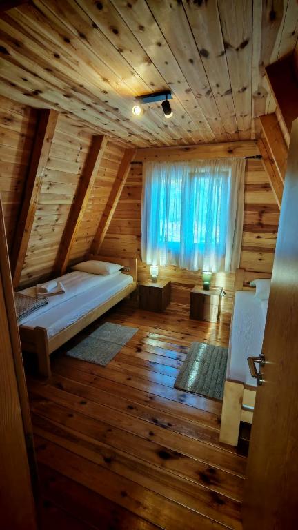 a large room with a bed and a window at Riverside Rooms in Šavnik