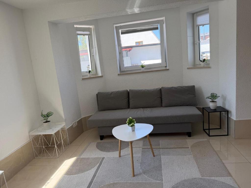 a living room with a couch and a table at Ferienwohnung Trinh 1 in Überlingen