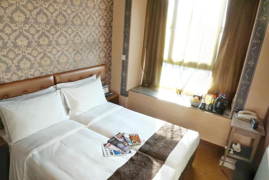 Postel nebo postele na pokoji v ubytování Best Western Hotel Causeway Bay