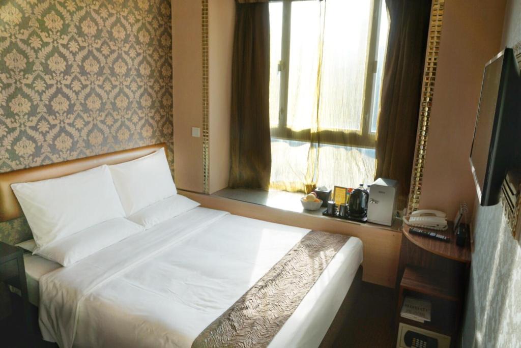 Postel nebo postele na pokoji v ubytování Best Western Hotel Causeway Bay