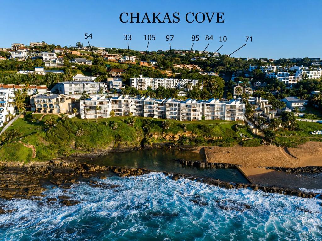 an aerial view of the chazes cove hotel and the ocean at Chakas Cove in Ballito
