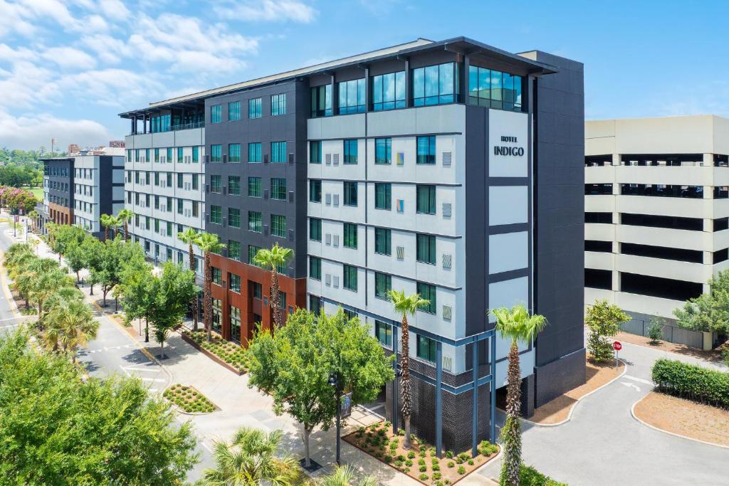 an architectural rendering of a building with palm trees at Hotel Indigo Tallahassee - Collegetown by IHG in Tallahassee
