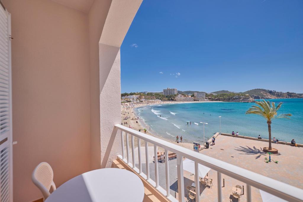 a balcony with a view of the beach and ocean at INNER Niza Paguera in Paguera