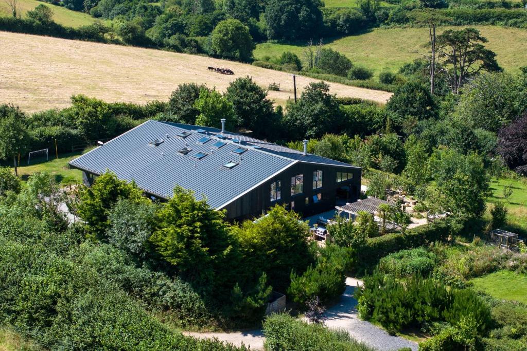 an overhead view of a building with solar panels on it at Northside in Kingsbridge