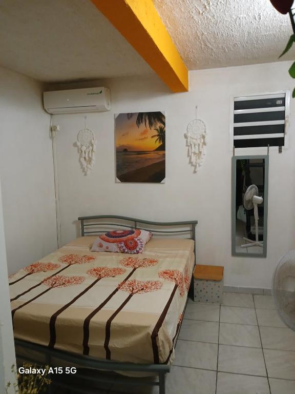 a bedroom with a bed in a room at F2 F3 Marjo tranquillity in Le Carbet