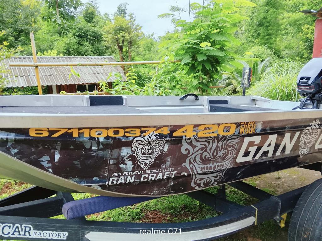 a boat sitting on the back of a trailer at Forest Fishing in Ban Pa Kluai