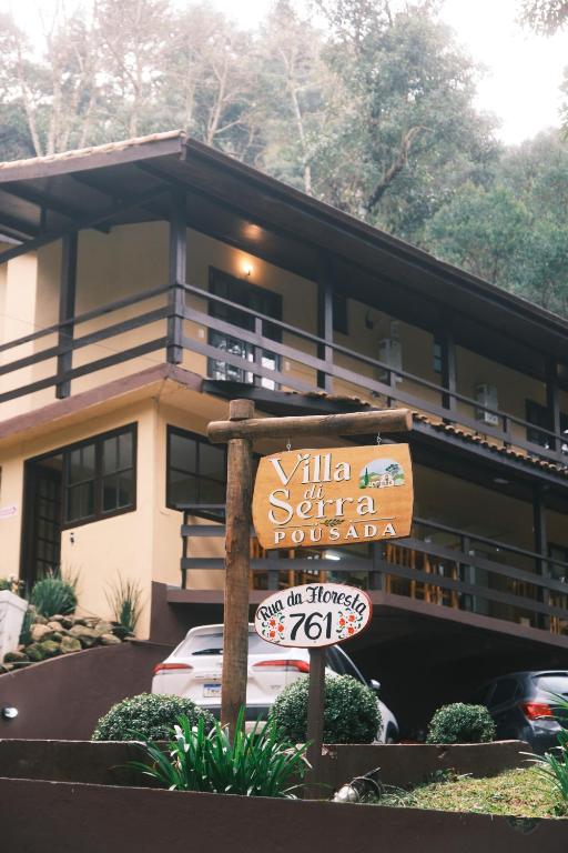 a building with a sign in front of it at Villa di Serra by Concavus in Monte Verde