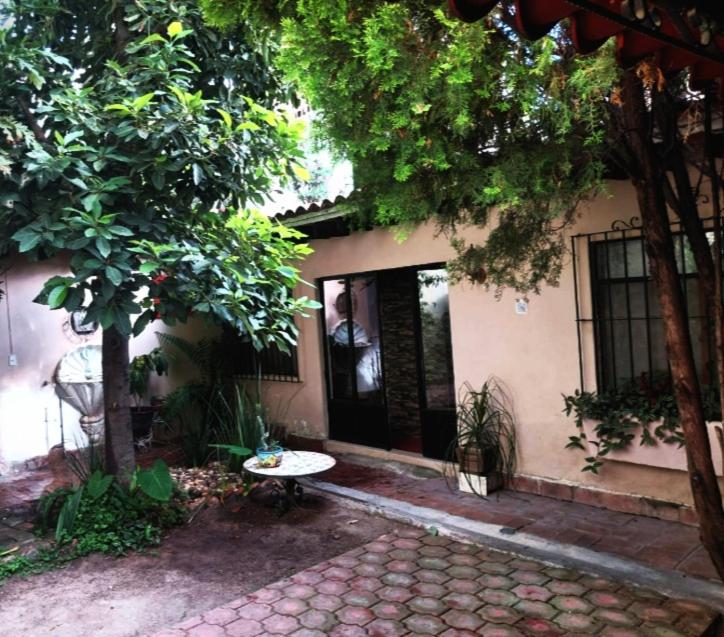 a building with a bench in front of a building at Casa xocolatl in San Miguel de Allende