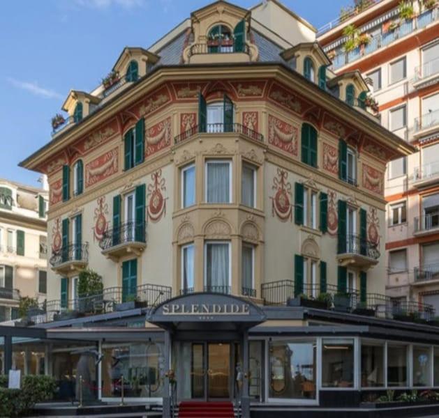 a large building in front of a building at Splendide Riviera Boutique Art Hotel in Rapallo
