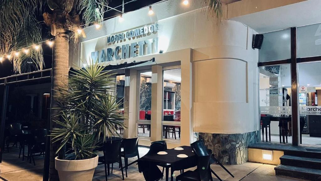 a restaurant with a table and chairs in front of it at Marchetti Hotel Comedor in Miramar
