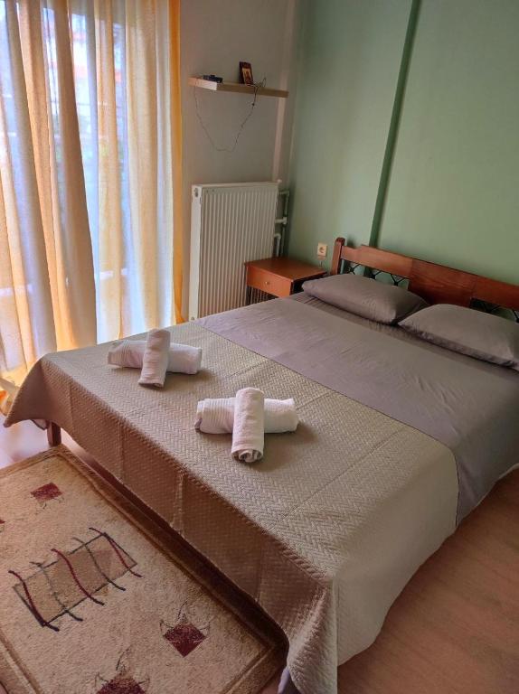 a bedroom with two beds with towels on them at GiannisHouse in Florina