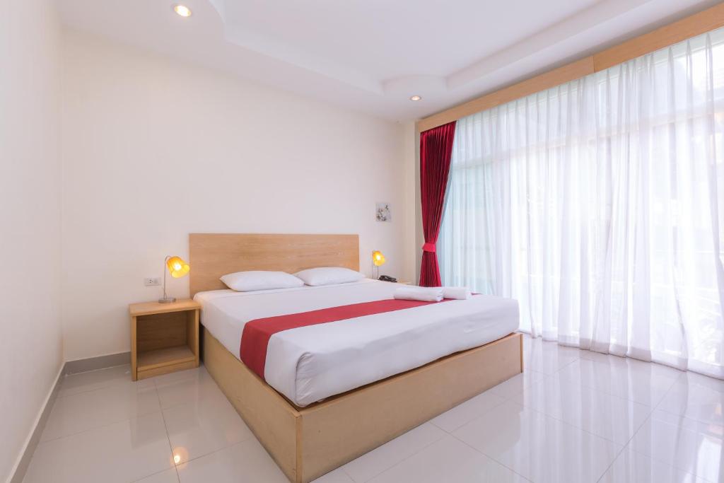 Postel nebo postele na pokoji v ubytování Zing Resort & Spa