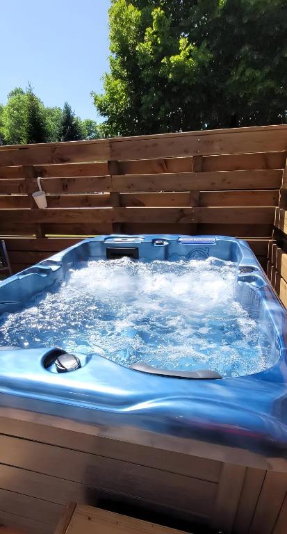 a large blue tub with water in it at Clos De La Ronziere Avec Jacuzzi in Soulages