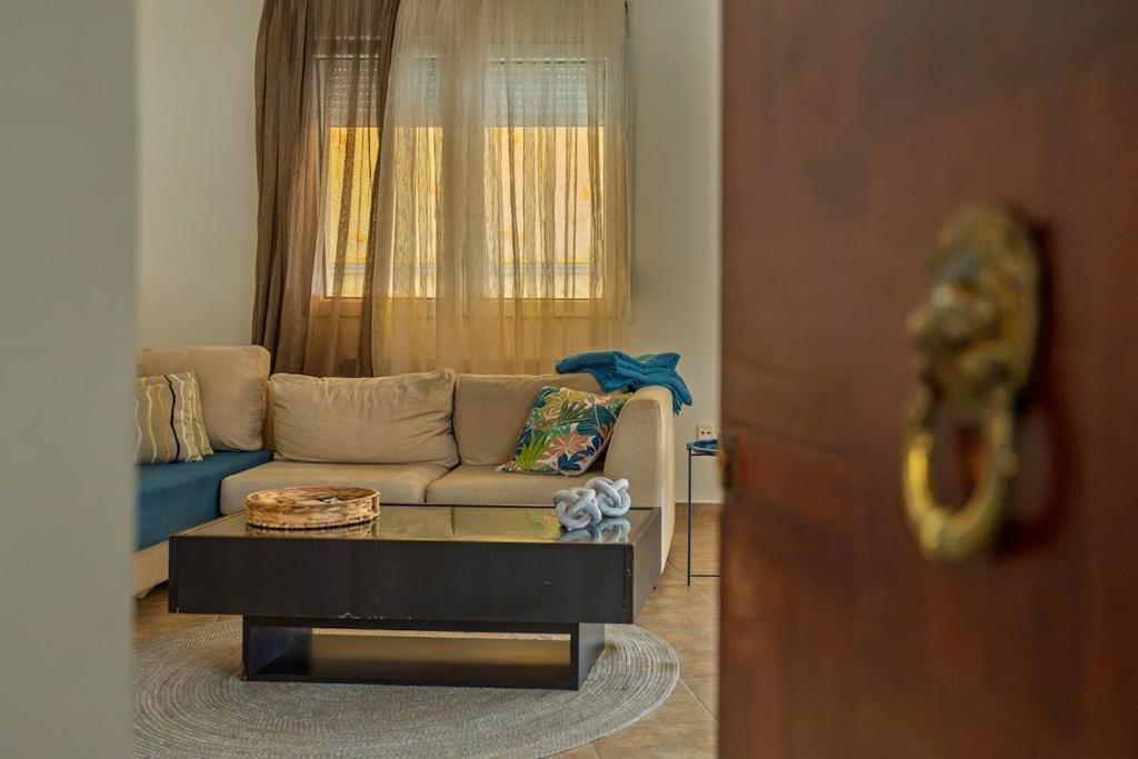 a living room with a couch and a coffee table at La Nonna in Komotini